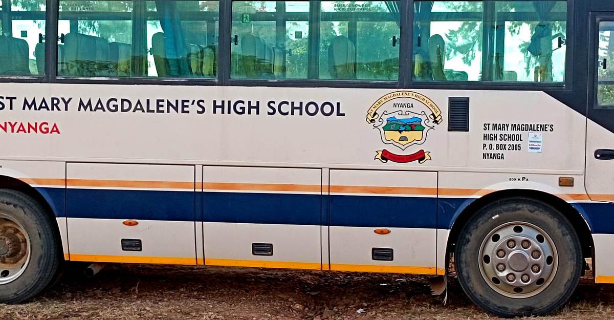 School bus bearing the St. Mary Magdalene's crest